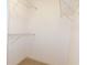 Walk-in closet with wire shelving and neutral carpeting at 554 Samaritan Dr, Cumming, GA 30040