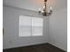 Bright dining room featuring hardwood floors and a chandelier at 554 Samaritan Dr, Cumming, GA 30040