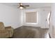 Living room with hardwood floors, a ceiling fan, a front door, and a large window at 554 Samaritan Dr, Cumming, GA 30040