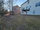 The backyard features a deck perfect for outdoor dining and relaxation at 7402 Gossamer St, Union City, GA 30291