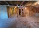 Unfinished basement with visible framing and open layout, ready to be customized at 7402 Gossamer St, Union City, GA 30291