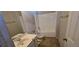 Bathroom featuring a white vanity and a tub and shower combo at 7402 Gossamer St, Union City, GA 30291