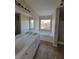 Bathroom with double sink vanity, soaking tub under a window, and separate shower at 7402 Gossamer St, Union City, GA 30291