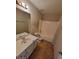 The bathroom features a single sink vanity and bathtub/shower combo at 7402 Gossamer St, Union City, GA 30291