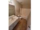 Standard bathroom with a single vanity, toilet, and shower-tub combination at 7402 Gossamer St, Union City, GA 30291