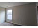 Bedroom featuring a window that offers natural light; ideal for creating a restful retreat at 7402 Gossamer St, Union City, GA 30291