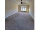 This bedroom features a ceiling fan and large windows, offering plenty of natural light at 7402 Gossamer St, Union City, GA 30291