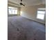 Large bedroom featuring ceiling fan and multiple windows that provide lots of natural light at 7402 Gossamer St, Union City, GA 30291
