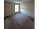 A sunlit bedroom, offering a blank canvas for your personal touch and decor vision at 7402 Gossamer St, Union City, GA 30291