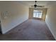 This bedroom features a ceiling fan and large windows, offering plenty of natural light at 7402 Gossamer St, Union City, GA 30291