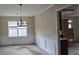 A dining room that is spacious and inviting with white trim at 7402 Gossamer St, Union City, GA 30291