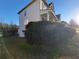 Charming home with a covered porch, a well-manicured lawn, and a neatly trimmed hedge at 7402 Gossamer St, Union City, GA 30291