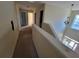 A hallway showing an open doorway and decorative chandelier at 7402 Gossamer St, Union City, GA 30291