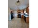 Well-lit kitchen with standard appliances and wood cabinets at 7402 Gossamer St, Union City, GA 30291