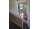 A staircase with an entry door at the bottom and high ceiling at 7402 Gossamer St, Union City, GA 30291