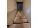 A view of the stairs leading down to the lower level of the home at 7402 Gossamer St, Union City, GA 30291