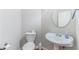 Cozy powder room featuring a pedestal sink and ample lighting at 113 Weatherstone Dr, Woodstock, GA 30188