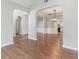 Open-concept living space with hardwood floors and elegant archways at 113 Weatherstone Dr, Woodstock, GA 30188