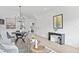 Open-concept living space with stylish decor, modern lighting, and views to the kitchen at 170 Chandler Trace, Covington, GA 30016