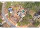 Aerial view displays the location of a home with a private pool in a neighborhood with mature landscaping at 320 Red Fox Dr, Canton, GA 30114