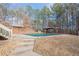 Spacious backyard with pool, gazebo, and stone steps from house at 320 Red Fox Dr, Canton, GA 30114