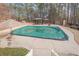 Backyard view of the pool under a green cover, as well as a gazebo and storage shed at 320 Red Fox Dr, Canton, GA 30114