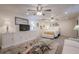 Finished basement showcasing a sitting area with television and a cozy bedroom in neutral tones at 320 Red Fox Dr, Canton, GA 30114