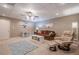 Cozy basement living space with a comfortable seating area and neutral decor at 320 Red Fox Dr, Canton, GA 30114
