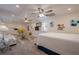 Finished basement with a kitchenette, a bed, and a comfortable living area at 320 Red Fox Dr, Canton, GA 30114