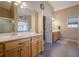 The bathroom features double sinks with light wood cabinets and a neutral color scheme at 320 Red Fox Dr, Canton, GA 30114
