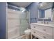 Bathroom with a white vanity and modern shower over bath at 320 Red Fox Dr, Canton, GA 30114