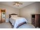 Cozy bedroom with carpet and a small dresser, located at the end of the hallway at 320 Red Fox Dr, Canton, GA 30114