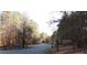 Sweetwater Campground sign and road with surrounding trees at 320 Red Fox Dr, Canton, GA 30114