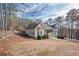 A side view of a charming single-Gathering home with a walkway leading to a covered front porch at 320 Red Fox Dr, Canton, GA 30114
