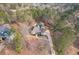 Beautiful home featuring a long driveway, lush landscaping, and a welcoming front porch at 320 Red Fox Dr, Canton, GA 30114