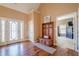 Elegant foyer featuring hardwood floors, a coat rack with storage, and decorative glass on front door at 320 Red Fox Dr, Canton, GA 30114
