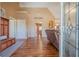 Welcoming foyer with hardwood flooring, a storage bench, and an arched doorway leading to the living area at 320 Red Fox Dr, Canton, GA 30114