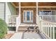 Charming front entrance with a decorative glass door, stone accents, and well-maintained landscaping at 320 Red Fox Dr, Canton, GA 30114