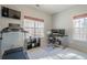Bright office area features treadmill, computer, and views of the yard at 320 Red Fox Dr, Canton, GA 30114