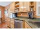 Bright kitchen with wooden cabinets and stainless steel appliances, next to the breakfast nook at 320 Red Fox Dr, Canton, GA 30114