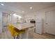 Kitchenette featuring white cabinets, butcher block island, stainless sink, microwave, and mini fridge at 320 Red Fox Dr, Canton, GA 30114