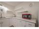 Corner kitchenette with a sink and white cabinetry at 320 Red Fox Dr, Canton, GA 30114