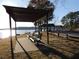 A bench sits in the shade near the lake at 320 Red Fox Dr, Canton, GA 30114