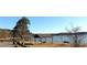 Scenic lake view with covered picnic tables and benches along the water's edge at 320 Red Fox Dr, Canton, GA 30114