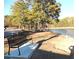 Peaceful lakeside bench providing a serene spot to enjoy the scenic water views and surrounding nature at 320 Red Fox Dr, Canton, GA 30114