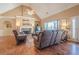 Relaxing living room with a stone fireplace, large windows, and hardwood floors at 320 Red Fox Dr, Canton, GA 30114