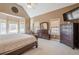 The spacious bedroom offers vaulted ceiling, a ceiling fan, and a set of dressers at 320 Red Fox Dr, Canton, GA 30114