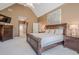 Spacious primary bedroom with a vaulted ceiling, natural light, and an ensuite bathroom at 320 Red Fox Dr, Canton, GA 30114