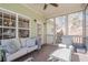 Relaxing screened-in porch with comfortable seating and view of the backyard at 320 Red Fox Dr, Canton, GA 30114