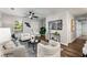 Spacious living room with modern furniture, a ceiling fan, and plenty of natural light at 338 Lincoln Sw St, Atlanta, GA 30315